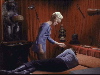 Chapel beside a sleeping Spock