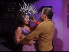 Kirk places helmet-like device on female alien