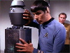 Spock performing mind probe on Nomad as Kirk watches
