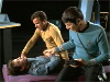 Kirk and Spock tend to McCoy