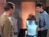 Kirk watches as Spock leads Jame by the arm